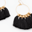 Black And Gold Tassel Earrings Close Up Top View